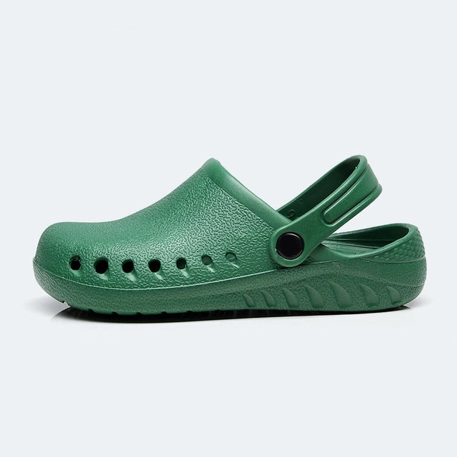 Lightweight slip-on nursing clog, green with perforated toe and adjustable heel strap