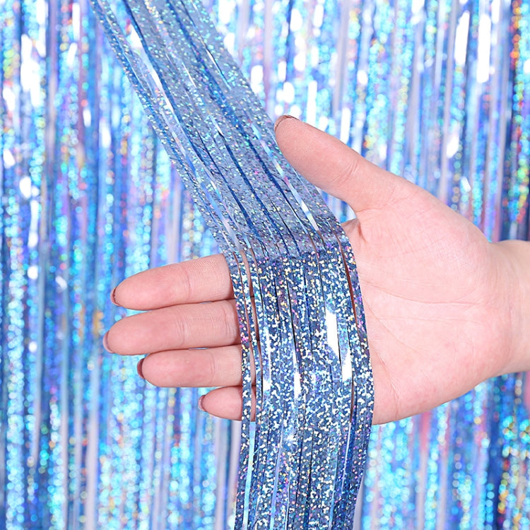 Blue silver laser foil fringe curtain tassels, hand holding reflective strands