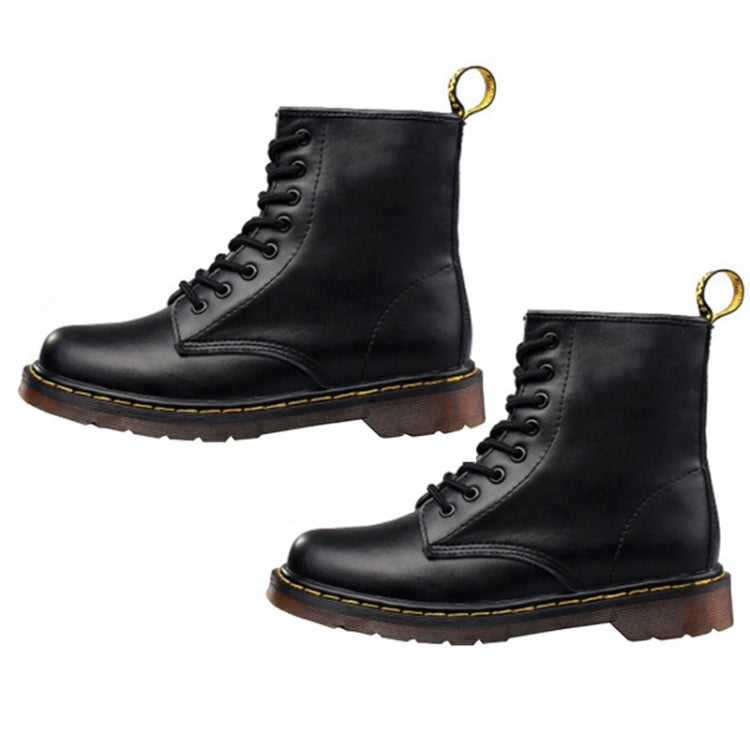 Pair of black lace-up Martin ankle boots with yellow eyelets and durable tread sole