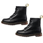 Pair of black lace-up ankle boots with chunky sole and gold pull loops