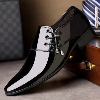 Men's pointed black leather dress shoe with glossy finish, lace-up and white stripe panels.