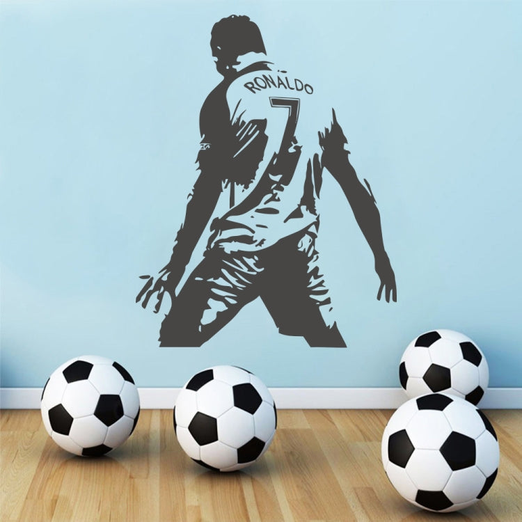 Black football player wall sticker silhouette with “RONALDO 7” emblem over floor