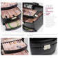 Black croc-texture jewelry box close-up of latch and layered interior compartments