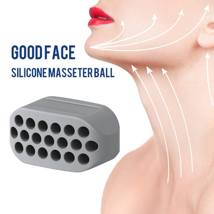Gray silicone masseter ball jaw trainer block with suction bump pads