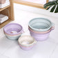 Set of folded washbasins: light blue, purple, and beige round tubs with side handles.