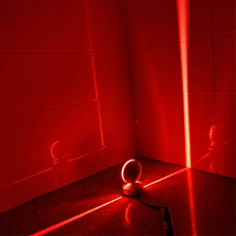LED wall spotlight with semicircle head glowing red light in corner