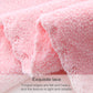 Pink coral fleece bath towel, close-up of fluffy terry pile and wavy edge