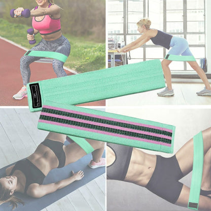 Light blue yoga loop resistance band with black grip stripes and label tag