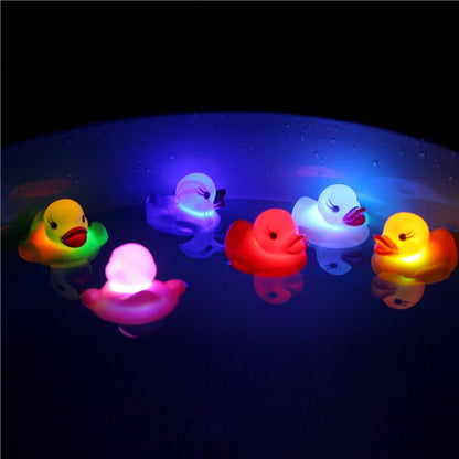 LED duck bath toy set, glowing multicolor rubber ducks floating in water