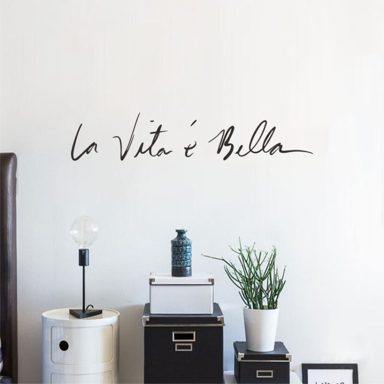 Black cursive wall sticker decal reading 'La Vita e Bella'.
