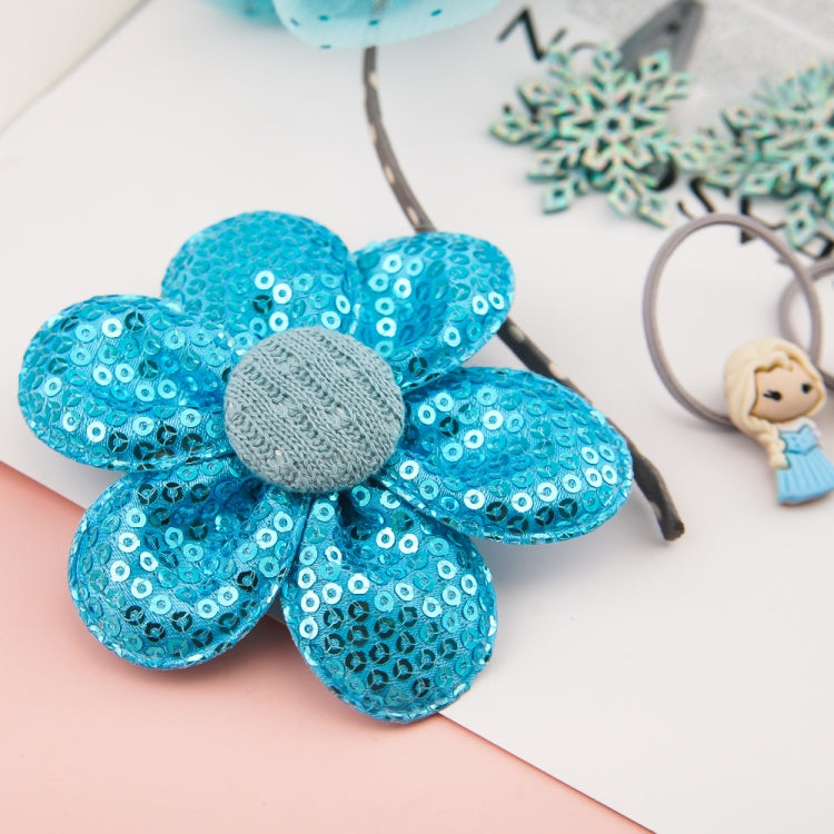 Blue sequin flower hair accessory with gray center on headband