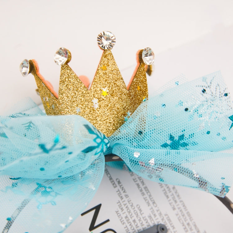 Gold crown headband with blue mesh bow and rhinestone tips