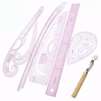 Sewing curve ruler set with multiple pink metric tailor rulers and wooden seam ripper