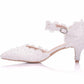 White lace pointed-toe heel with ankle strap, silver buckle, and beaded embellishments