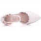 White lace pointed-toe shoe showing open insole and ankle strap with silver buckle