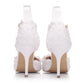 Pair of white lace high-heel shoes with back straps and pearl-like bead embellishments