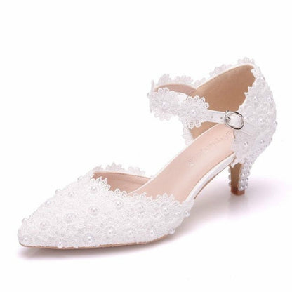 White lace pointed-toe high-heel with pearl-like bead detail and silver buckle ankle strap