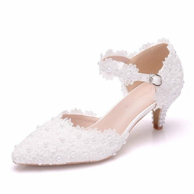 Women's white lace pointed heels with pearl floral trim and buckle ankle strap