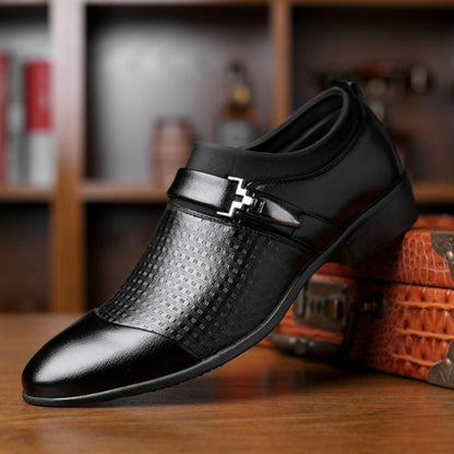 Black men's dress shoe with silver patterned side panel and decorative buckle strap