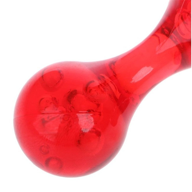 Close-up of red four-ball manual massager with raised node pattern