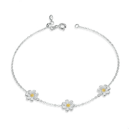 Sterling silver daisy charm bracelet with small yellow center flowers