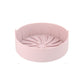 Pink round silicone grill pan insert with ridged radial channels and center hub