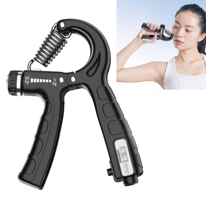 Black mechanical hand gripper with adjustable spring and strength scale