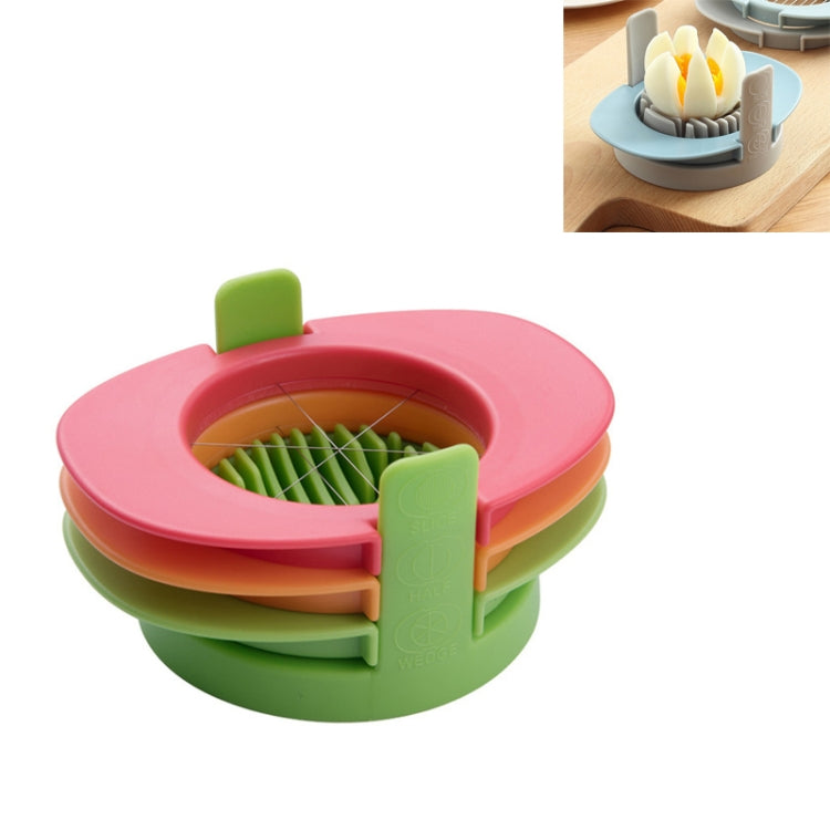 Multifunctional egg cutter with colorful stacking base and half-cut insert, green and pink