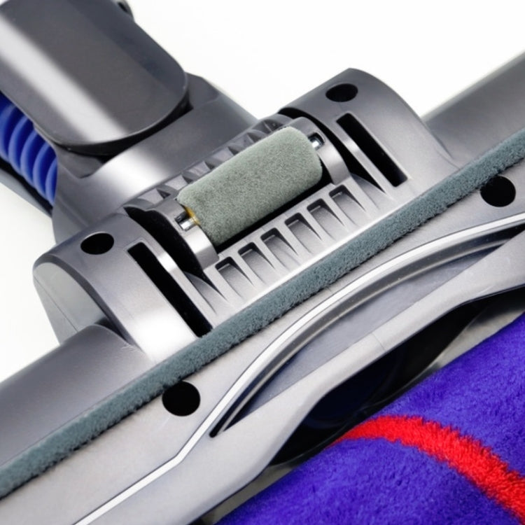 Electric vacuum brush head showing grey roller brush and dust pickup channel