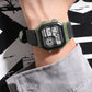 SYNOKE digital wristwatch on wrist with green case and black fabric strap