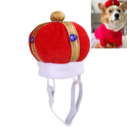 Red plush pet crown hat with gold trim, blue jewel accents, and white elastic chin strap.