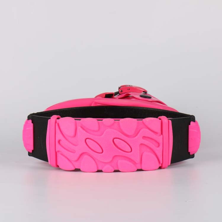 Pink and black jumping shoe sole with textured tread and adjustable strap