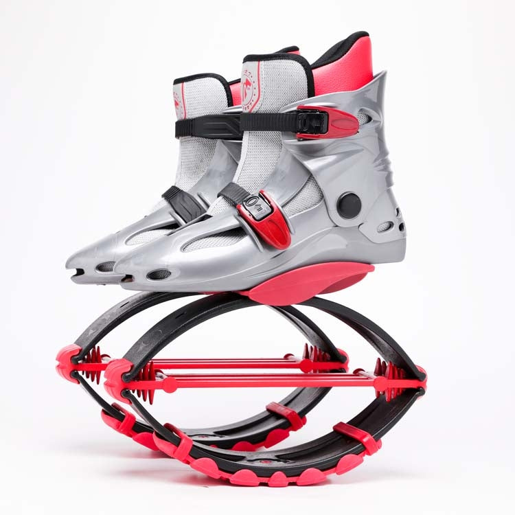 Gray high-top spring shoe with red accent sole and buckled ankle strap frame