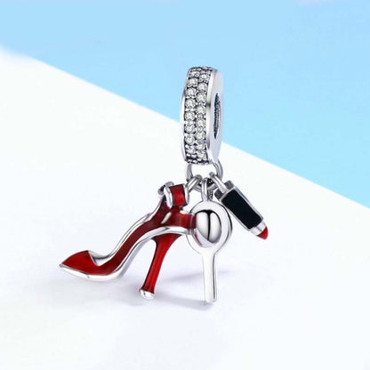 Sterling silver charm pendant with red high heel, lipstick, and makeup mirror
