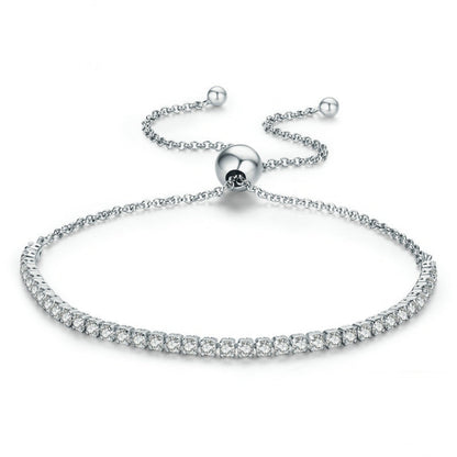 Adjustable silver tennis bracelet with round rhinestone rows and ball clasp charm