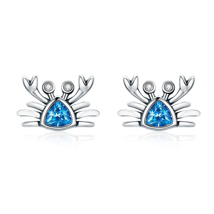 Oxidized silver crab earrings with heart-shaped blue gemstone and small crystal accents