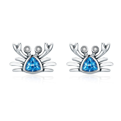 Oxidized silver crab earrings with heart-shaped blue gemstone and small crystal accents