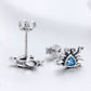 Oxidized silver crab earrings with blue heart-shaped gemstone and butterfly back posts