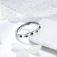 Sterling silver band ring with black paw prints and engraved inner marking