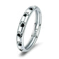 Sterling silver paw print ring with black enamel footprints, glossy band