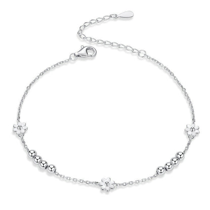 Sterling silver daisy bead bracelet with flower charms and lobster clasp closure