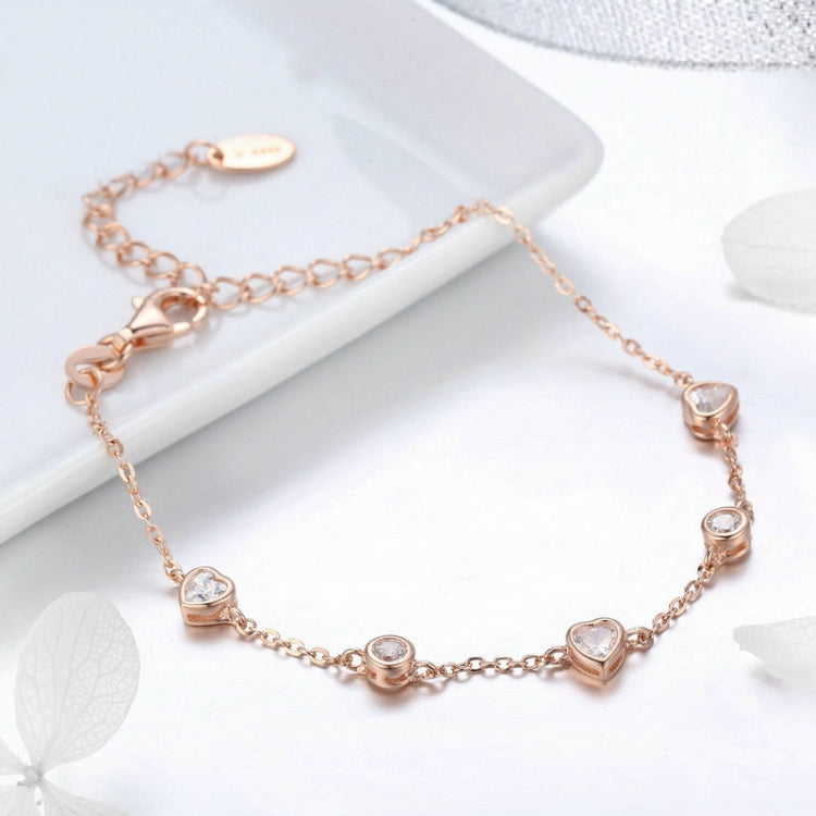Rose gold plated zircon bracelet with round and heart crystal charms, toggle clasp