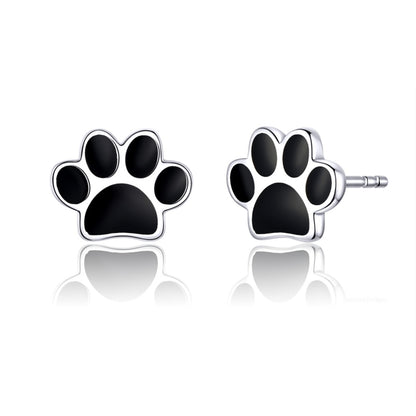 Sterling silver paw print stud earrings with black enamel pads and round center