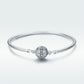 Sterling silver bangle bracelet with round paved bead center and small bead spacers