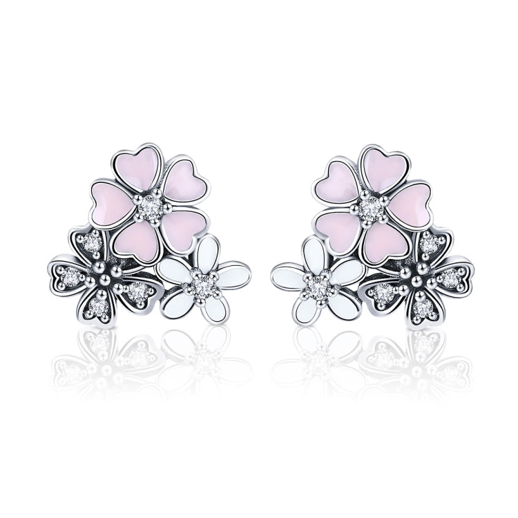 Sterling silver flower earrings with pink enamel petals and sparkling cubic zirconia
