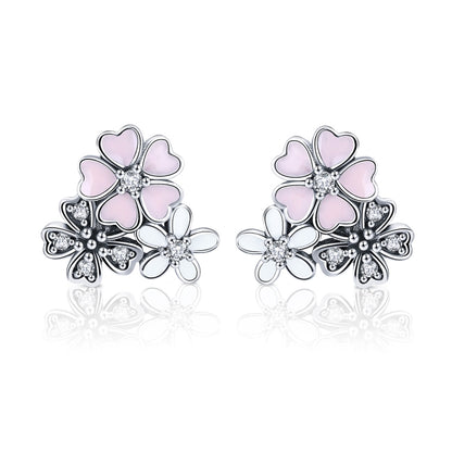 Sterling silver flower earrings with pink enamel petals and sparkling cubic zirconia