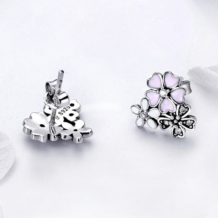 Sterling silver flower stud earrings with pink enamel petals; visible post and back