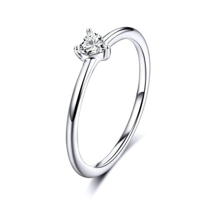Heart-shaped clear CZ solitaire ring with slender sterling silver band