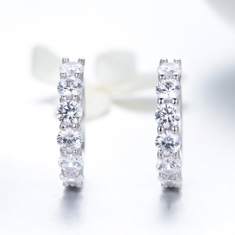 Sterling silver hoop earrings with five clear CZ stones per hoop