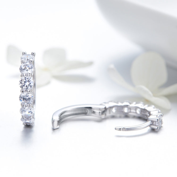 Sterling silver hoop earrings with five CZ stones and hinged clasp